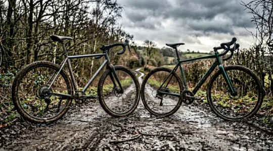 Gravel bike and cyclocross bike side by side on muddy British trail in winter conditions