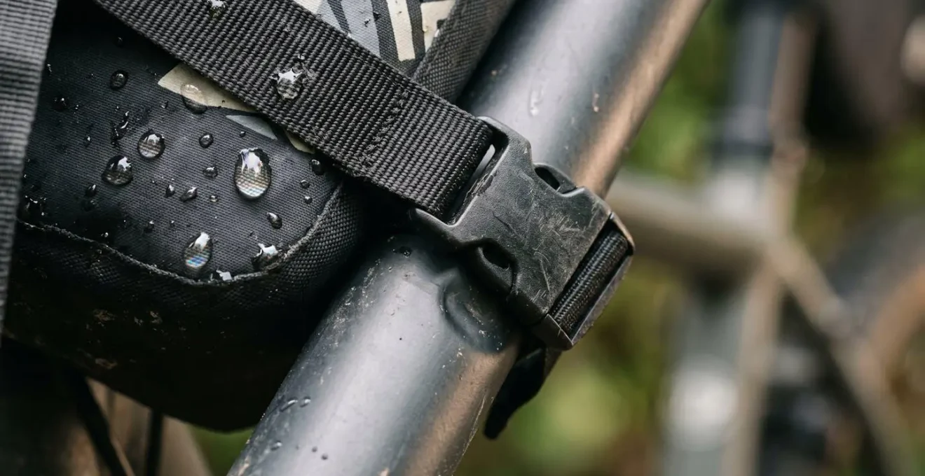 Close-up detail of loaded bikepacking setup showing center of gravity principles