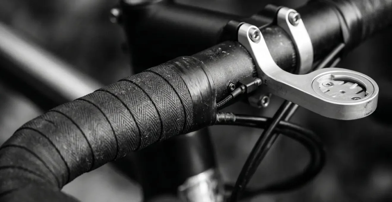 Close-up of minimalist bicycle handlebar setup with radar but no display screen