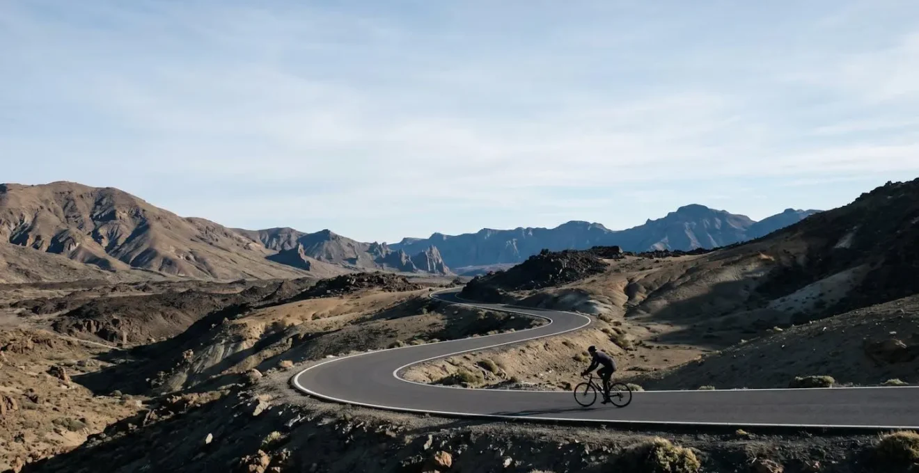 Minimalist winter cycling destination landscape with mountain roads